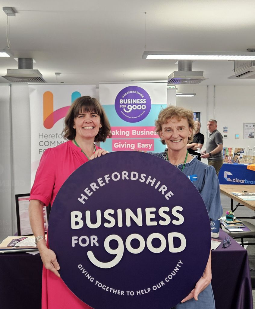 Bridie Sullivan and current High Sheriff Helen Bowden pose with Business for Good circular board.