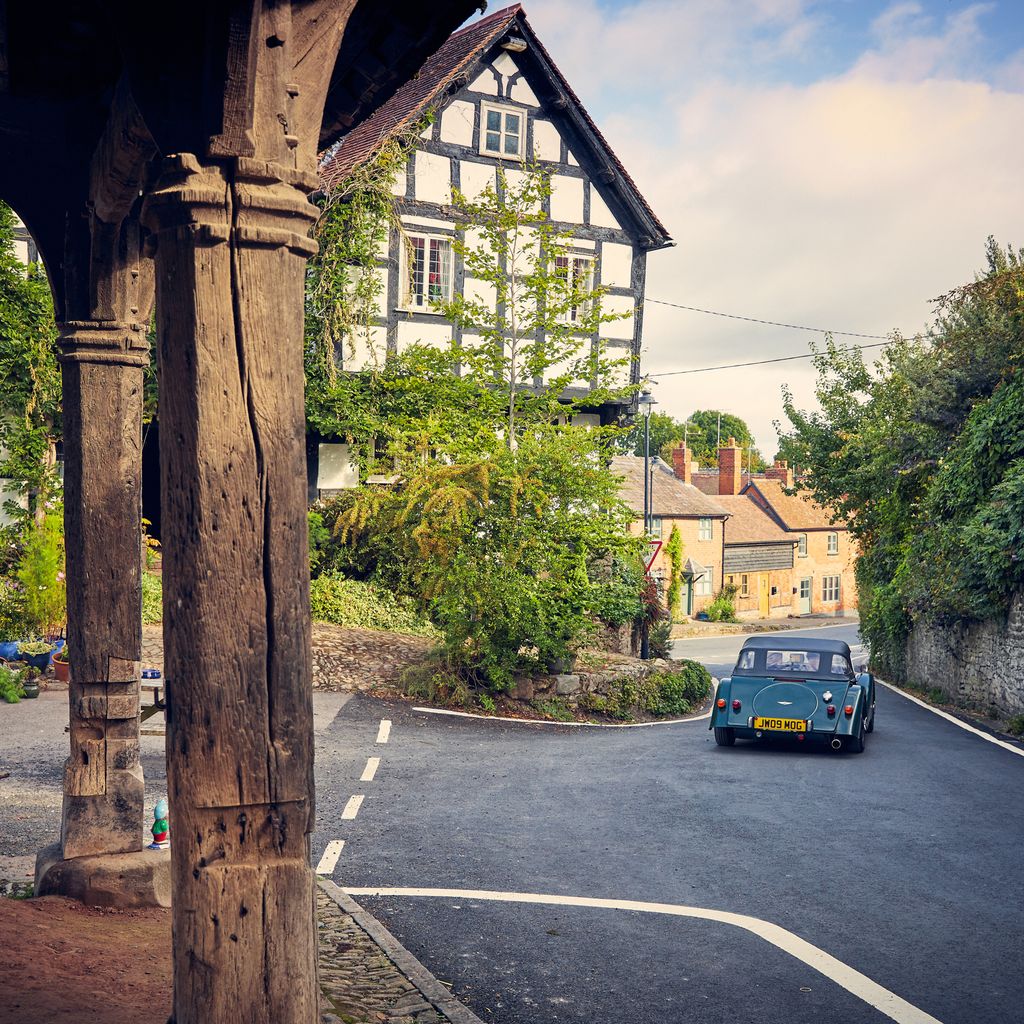 Car driving through Black & White Village